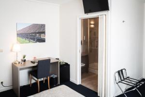 Postel nebo postele na pokoji v ubytování Hotel Essenza