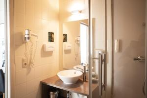 Koupelna v ubytování Hotel Essenza