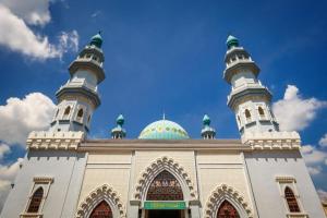 a building with two domes on top of it at Taipann Hotel in Kampong Telok Gadong Besar +10 photos