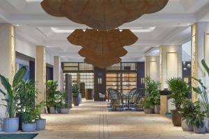 a lobby with potted plants and a large ceiling at JW Marriott Gold Coast Resort & Spa in Gold Coast +209 photos