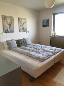 a bedroom with a large bed in a room at Lovely Holiday Home On Lolland in Errindlev