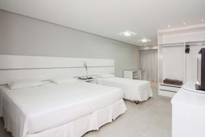 Ένα ή περισσότερα κρεβάτια σε δωμάτιο στο Brisa Tower Hotel
