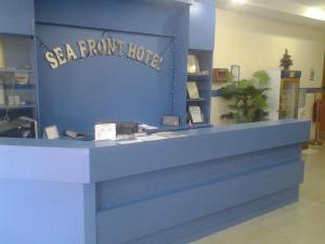 a santa fe hotel sign on a blue wall at Sea Front Hotel Port Dickson in Kampong Arab