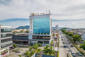 a view of a city with a tall building at Pelican Hotel in Batu Pahat
