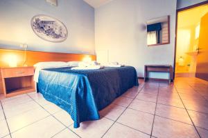 Postel nebo postele na pokoji v ubytování Hotel La Gaietta