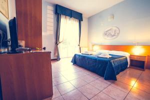 Postel nebo postele na pokoji v ubytování Hotel La Gaietta