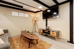Telewizja i/lub zestaw kina domowego w obiekcie Tirso Loft en Madrid