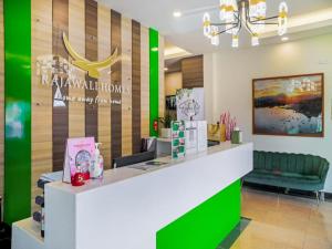 a store with a green and white counter in a room at Rajawali Homes Kota Marudu in Kampong Tumsun