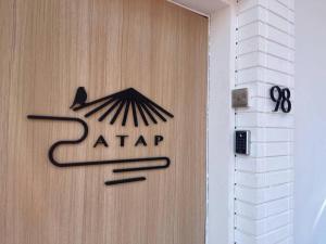 a door with the name of a akari on it at ATAP Hotel in Kota Kinabalu