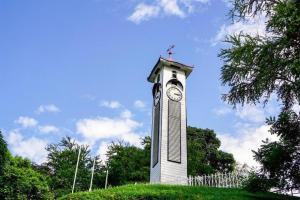 a clock tower with a cross on top of it at ATAP Hotel in Kota Kinabalu
