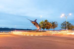 a statue of a shark on the side of a road at ATAP Hotel in Kota Kinabalu