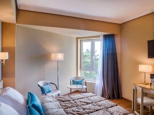 Posteľ alebo postele v izbe v ubytovaní Mercure Monte Igueldo
