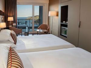 Posteľ alebo postele v izbe v ubytovaní Mercure Monte Igueldo