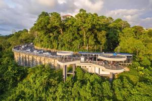 an overhead view of a bridge with cars on a road at Capital O 90998 Margo Home in Kampong Layan