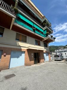 a building with a parking lot in front of it at Perla Blu by PortofinoVacanze in Rapallo
