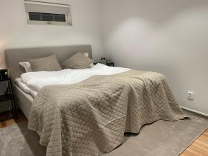 a bedroom with a bed with a blanket on it at Kläppen Gullbrändan 1232b in Kläppen +5 photos