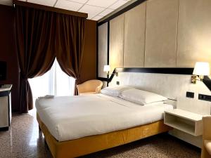 Postel nebo postele na pokoji v ubytování Hotel Diamante
