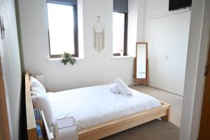 Ένα ή περισσότερα κρεβάτια σε δωμάτιο στο Stunning City Centre Duplex