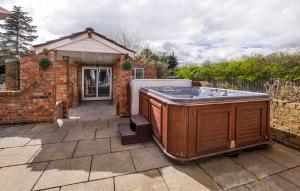 a hot tub in the backyard of a house at The PADhouse in York