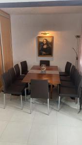 a dining room with a wooden table and chairs at Quinta do Palhal de Baixo in Febres