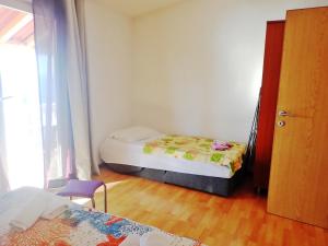 Postel nebo postele na pokoji v ubytování Apartments Bili