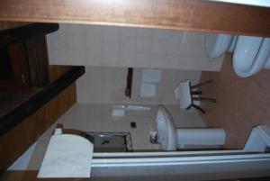 a small bathroom with a toilet and a sink at B&B della Miniera in Cogne