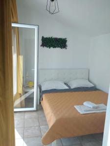 Postel nebo postele na pokoji v ubytování Apartments Bili