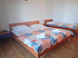 Postel nebo postele na pokoji v ubytování Apartments Bili