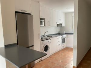 Кухня или мини-кухня в Apartahotel Vistamar San José
