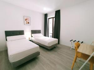 Postel nebo postele na pokoji v ubytování Hotel Gran Vía by gaiarooms