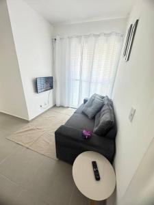 TV a/nebo společenská místnost v ubytování Apartamento com suíte