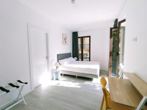 Postel nebo postele na pokoji v ubytování Hotel Gran Vía by gaiarooms