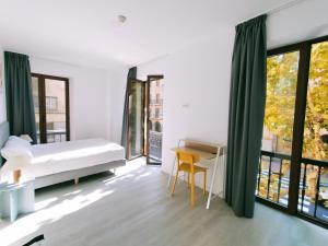 Postel nebo postele na pokoji v ubytování Hotel Gran Vía by gaiarooms