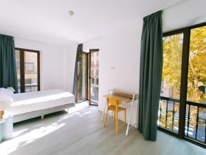 Postel nebo postele na pokoji v ubytování Hotel Gran Vía by gaiarooms