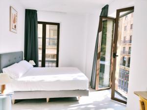 Postel nebo postele na pokoji v ubytování Hotel Gran Vía by gaiarooms