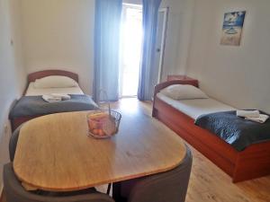 Postel nebo postele na pokoji v ubytování Apartments Bili