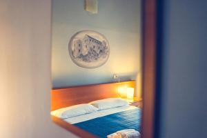 Postel nebo postele na pokoji v ubytování Hotel La Gaietta