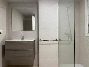 Ванная комната в Apartahotel Vistamar San José