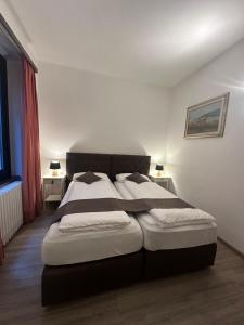 Voodi või voodid majutusasutuse Hotel Croce Federale toas