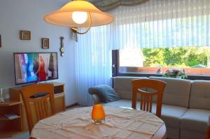 a living room with a couch and a table at Wiesenweg - Wohnung 06 in Wyk auf Föhr