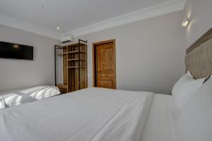 Postel nebo postele na pokoji v ubytování Hotel Resident Bishkek