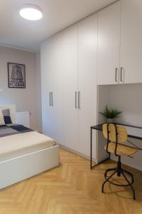 Ένα ή περισσότερα κρεβάτια σε δωμάτιο στο Apartament Smardzewska 5 - Grunwald