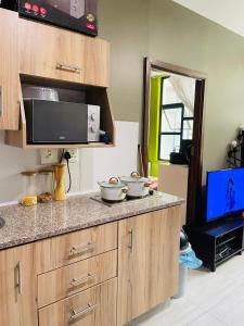 a kitchen with two bowls on a counter at Feel at home in Durban