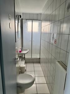 Koupelna v ubytování Hotel Hildesheimer Hof