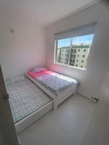 Cama ou camas em um quarto em Alojamiento Restrepo Meta