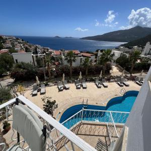 a view of a resort with a swimming pool at The Bay View Boutique Hotel Kalkan in Kas +30 photos
