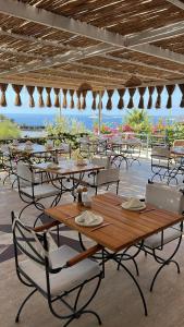a group of tables and chairs in a restaurant at The Bay View Boutique Hotel Kalkan in Kas