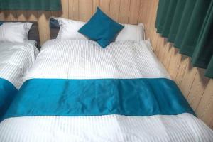 Katil atau katil-katil dalam bilik di 無料駐車場有り 新大阪駅まで1駅1分 Guest House 橘 東三国,最大14名,最寄り駅まで徒歩5分,2階建て貸切