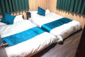 Katil atau katil-katil dalam bilik di 無料駐車場有り 新大阪駅まで1駅1分 Guest House 橘 東三国,最大14名,最寄り駅まで徒歩5分,2階建て貸切