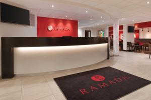 
a large room with a large poster on the wall at Ramada Wakefield in Wakefield
